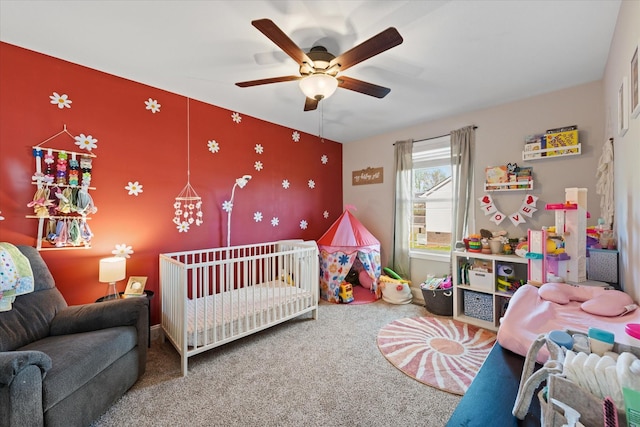 2229 Allen Griffey Rd, Clarksville, TN 37042 - carpeted bedroom featuring a nursery area, ceiling fan, and an accent wall