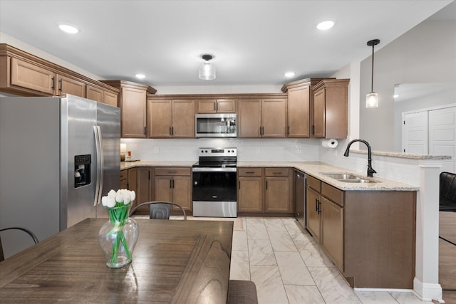 2229 Allen Griffey Rd, Clarksville, TN 37042 - kitchen featuring backsplash, appliances with stainless steel finishes, a sink, a peninsula, and marble finish floor