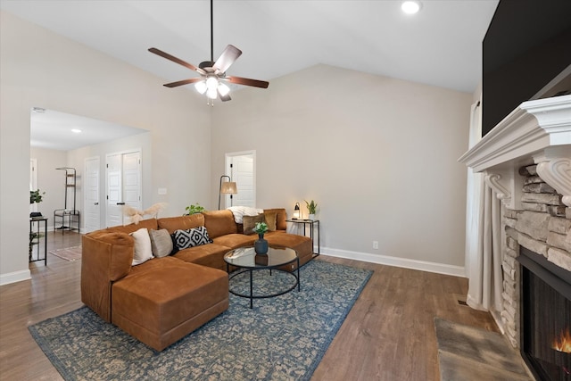 2229 Allen Griffey Rd, Clarksville, TN 37042 - living room with a stone fireplace, baseboards, ceiling fan, and wood finished floors