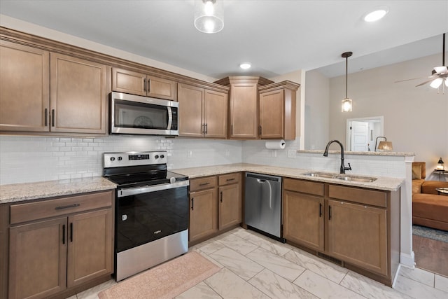 2229 Allen Griffey Rd, Clarksville, TN 37042 - kitchen featuring ceiling fan, a sink, a peninsula, marble finish floor, and stainless steel appliances