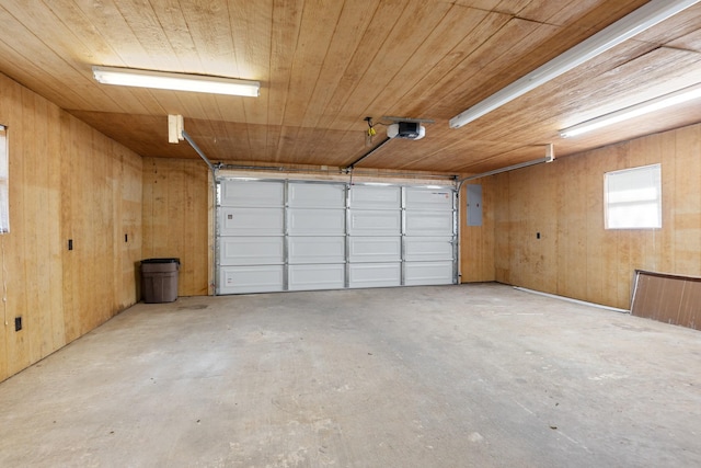 garage featuring a garage door opener, wooden ceiling, wood walls, and electric panel