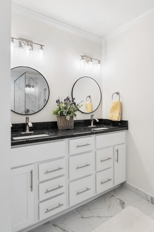 bathroom with a sink, double vanity, marble finish floor, and crown molding