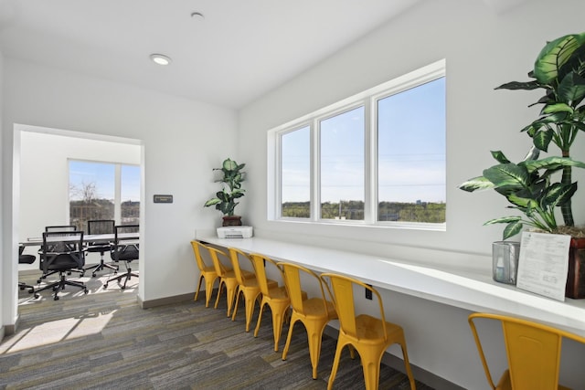 dining room featuring recessed lighting and baseboards