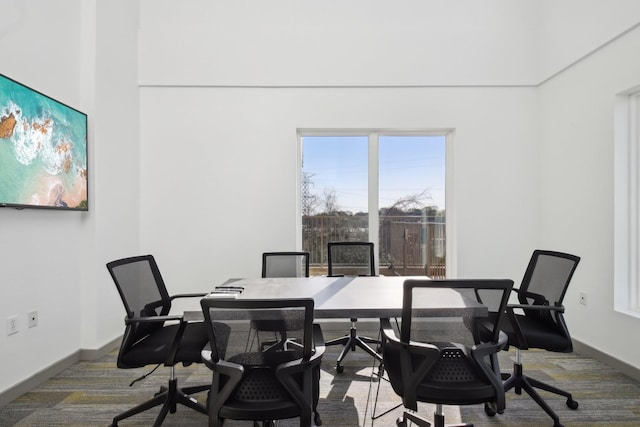 home office featuring carpet flooring and baseboards