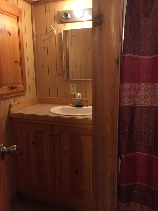 5735 Railroad St, Williston, TN 38076 - bathroom with vanity, a shower with curtain, and wooden walls