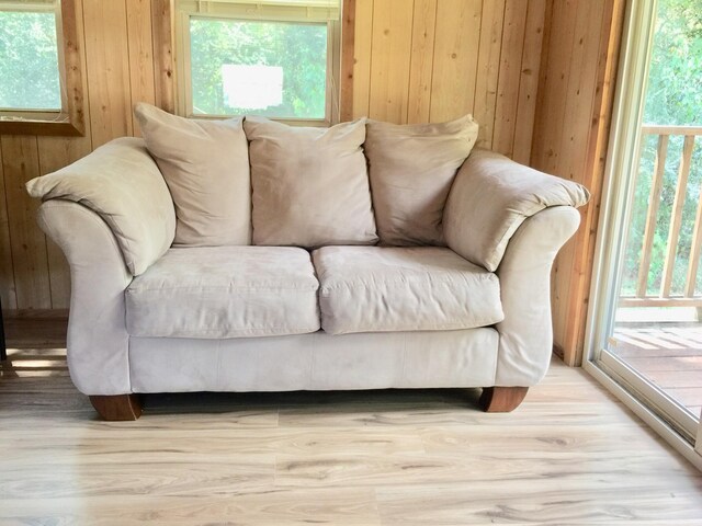 5735 Railroad St, Williston, TN 38076 - living room with wood walls, wood finished floors, and healthy amount of natural light
