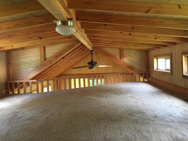 5735 Railroad St, Williston, TN 38076 - additional living space with carpet floors, beamed ceiling, a ceiling fan, and wood walls