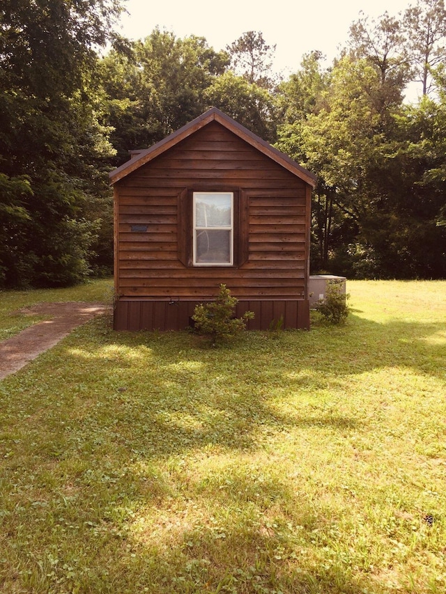 5735 Railroad St, Williston, TN 38076 - view of home's exterior featuring a lawn