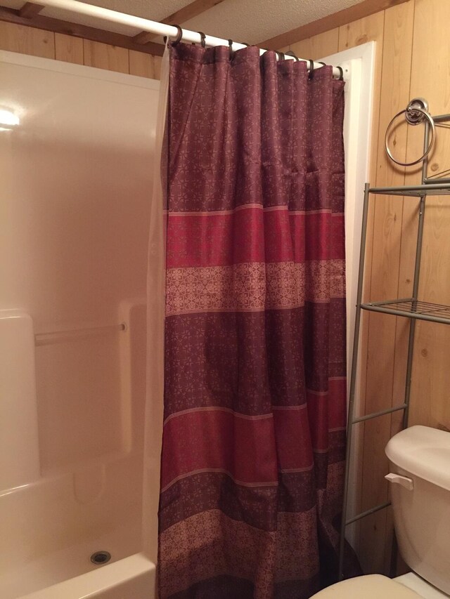 5735 Railroad St, Williston, TN 38076 - bathroom with curtained shower and toilet