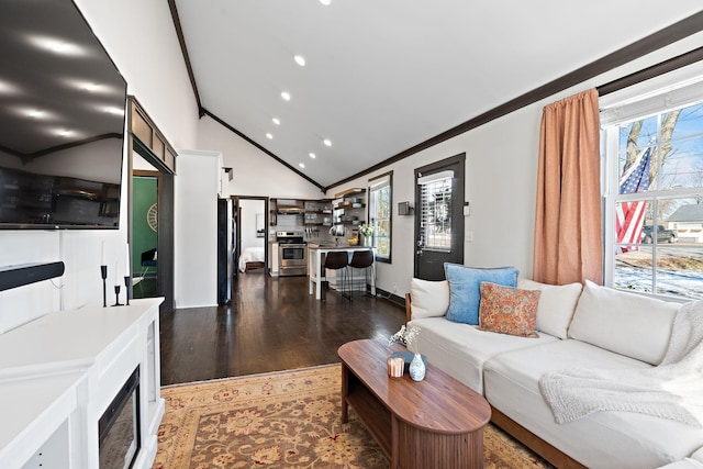 living area with baseboards, vaulted ceiling, ornamental molding, recessed lighting, and wood finished floors