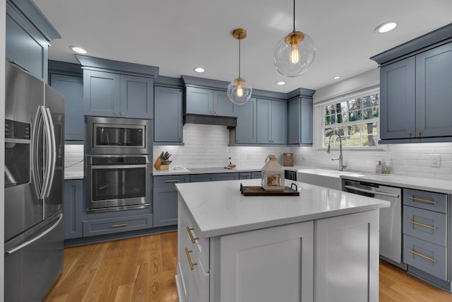 6112 Frontier Ct, Nashville, TN 37211 - kitchen with a sink, decorative light fixtures, a center island, tasteful backsplash, and appliances with stainless steel finishes