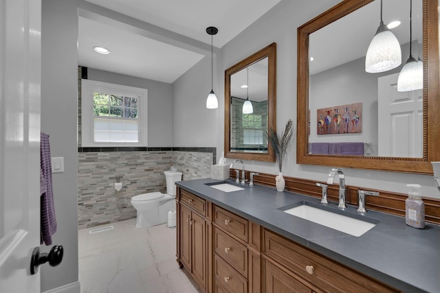 6112 Frontier Ct, Nashville, TN 37211 - bathroom featuring tile walls, marble finish floor, a sink, and toilet
