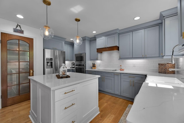 6112 Frontier Ct, Nashville, TN 37211 - kitchen with gray cabinets, light wood-style floors, stainless steel appliances, and a sink
