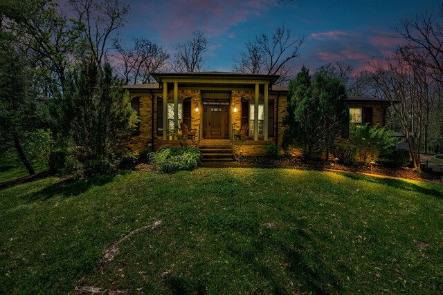 6112 Frontier Ct, Nashville, TN 37211 - view of front of house featuring a lawn, brick siding, and covered porch