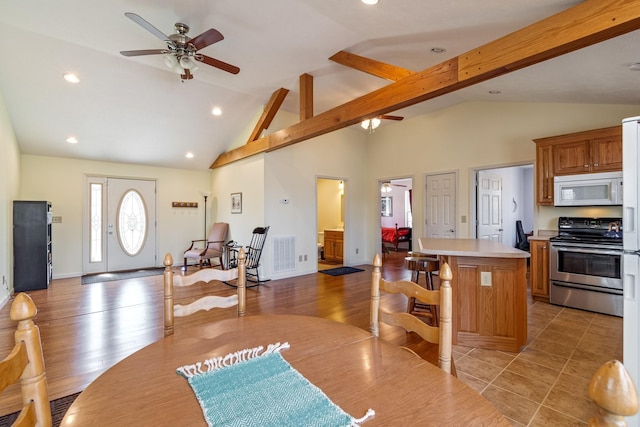283 Dyestone Springs Rd, Hohenwald, TN 38462 - dining space with a ceiling fan, recessed lighting, high vaulted ceiling, and beam ceiling