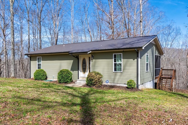 283 Dyestone Springs Rd, Hohenwald, TN 38462 - view of front of home with metal roof, a front lawn, and crawl space