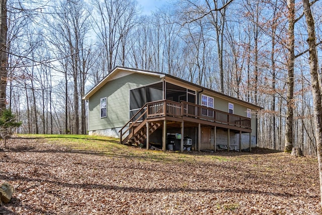 283 Dyestone Springs Rd, Hohenwald, TN 38462 - rear view of property with a wooden deck, stairway, a sunroom, and crawl space
