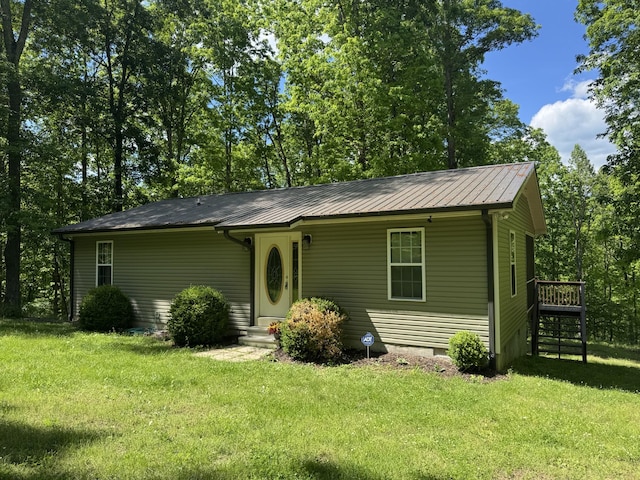 283 Dyestone Springs Rd, Hohenwald, TN 38462 - view of front of home with a front lawn and metal roof