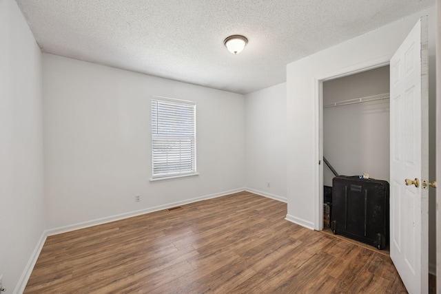 130 Gail St, Oak Grove, KY 42262 - unfurnished bedroom featuring a closet, baseboards, and wood finished floors