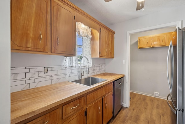 130 Gail St, Oak Grove, KY 42262 - kitchen featuring a sink, butcher block counters, tasteful backsplash, and stainless steel appliances