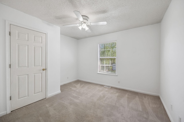 130 Gail St, Oak Grove, KY 42262 - carpeted spare room with a textured ceiling, baseboards, and a ceiling fan
