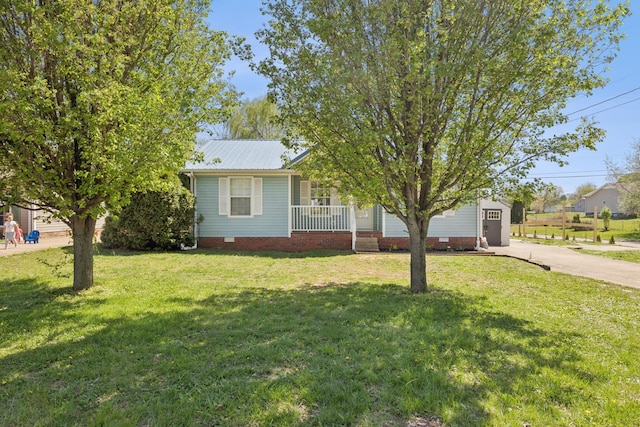 130 Gail St, Oak Grove, KY 42262 - view of front of home with concrete driveway, metal roof, crawl space, and a front lawn