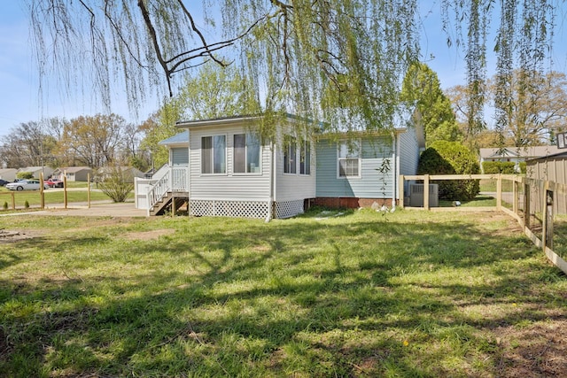 130 Gail St, Oak Grove, KY 42262 - rear view of property with a yard and fence