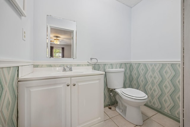 130 Gail St, Oak Grove, KY 42262 - half bathroom featuring toilet, a ceiling fan, wainscoting, vanity, and tile patterned flooring