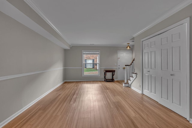 5025 Hillsboro Pike Unit 22D, Nashville, TN 37215 - unfurnished living room featuring light wood finished floors, baseboards, ornamental molding, and stairs