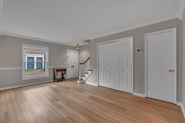 5025 Hillsboro Pike Unit 22D, Nashville, TN 37215 - entryway featuring light wood-style floors, ornamental molding, and stairway