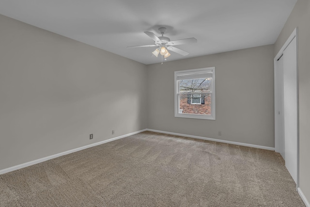 5025 Hillsboro Pike Unit 22D, Nashville, TN 37215 - unfurnished bedroom with a closet, ceiling fan, baseboards, and carpet floors