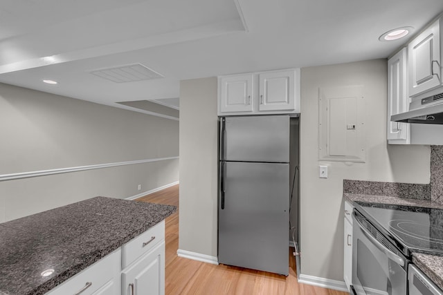 5025 Hillsboro Pike Unit 22D, Nashville, TN 37215 - kitchen with visible vents, range with electric cooktop, light wood-type flooring, freestanding refrigerator, and under cabinet range hood