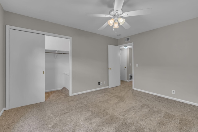 5025 Hillsboro Pike Unit 22D, Nashville, TN 37215 - unfurnished bedroom with baseboards, a closet, light carpet, a ceiling fan, and visible vents