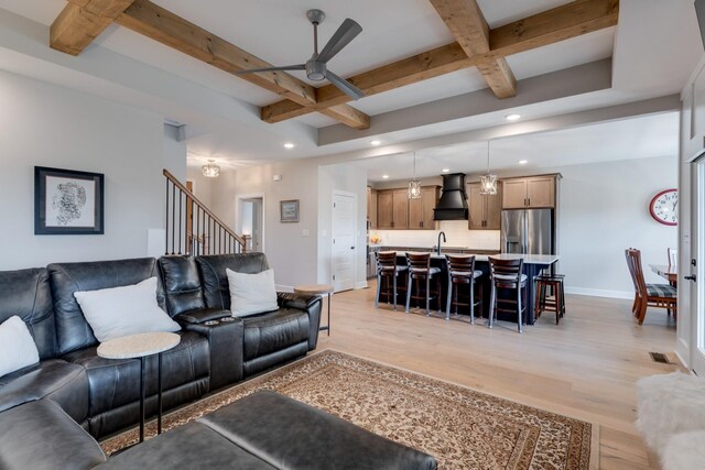 405 Sheas Way, Clarksville, TN 37043 - living room with coffered ceiling, baseboards, beamed ceiling, a ceiling fan, and light wood finished floors