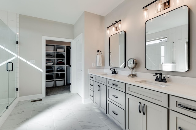 405 Sheas Way, Clarksville, TN 37043 - full bathroom with double vanity, a stall shower, a spacious closet, marble look tile flooring, and baseboards