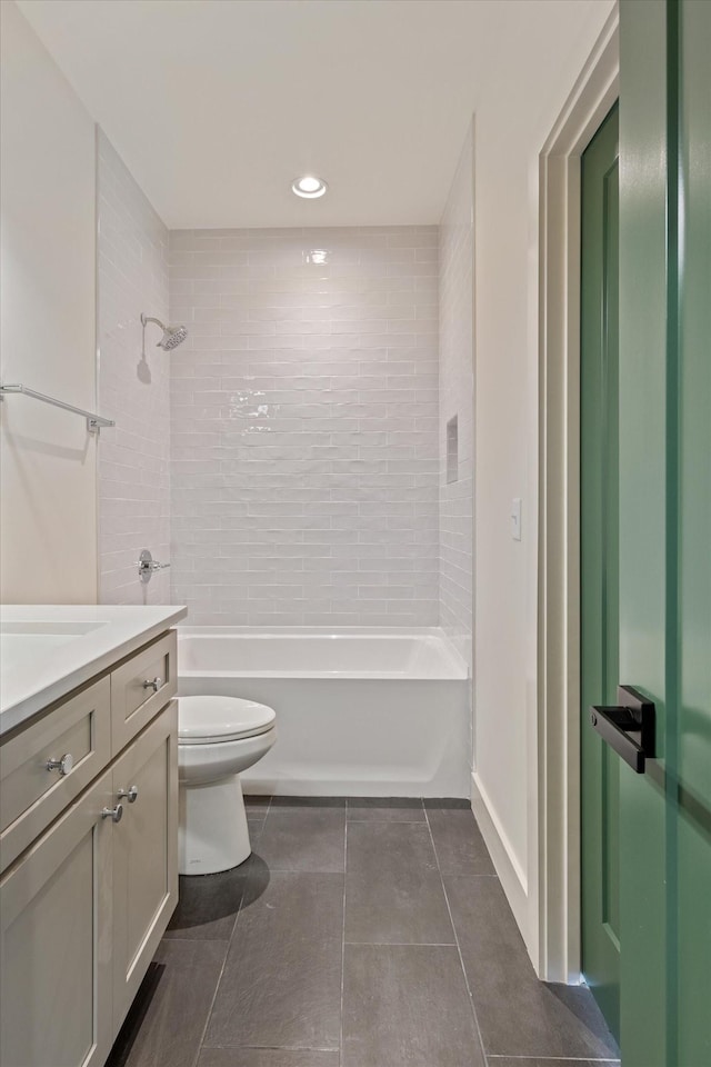 full bathroom featuring washtub / shower combination, recessed lighting, tile patterned floors, toilet, and vanity