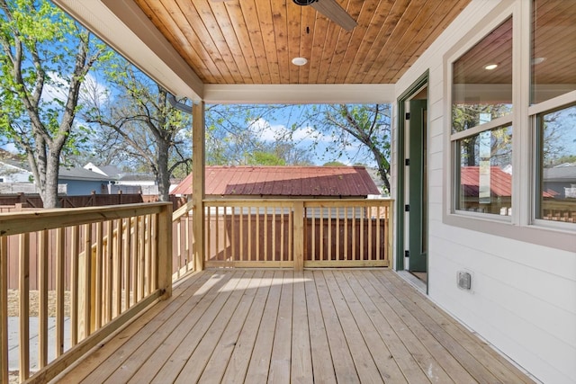 wooden deck featuring fence and ceiling fan