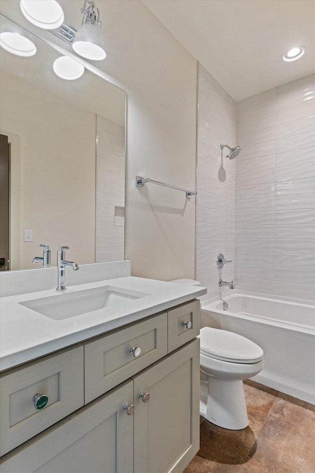 bathroom with recessed lighting, toilet, vanity, and bathing tub / shower combination