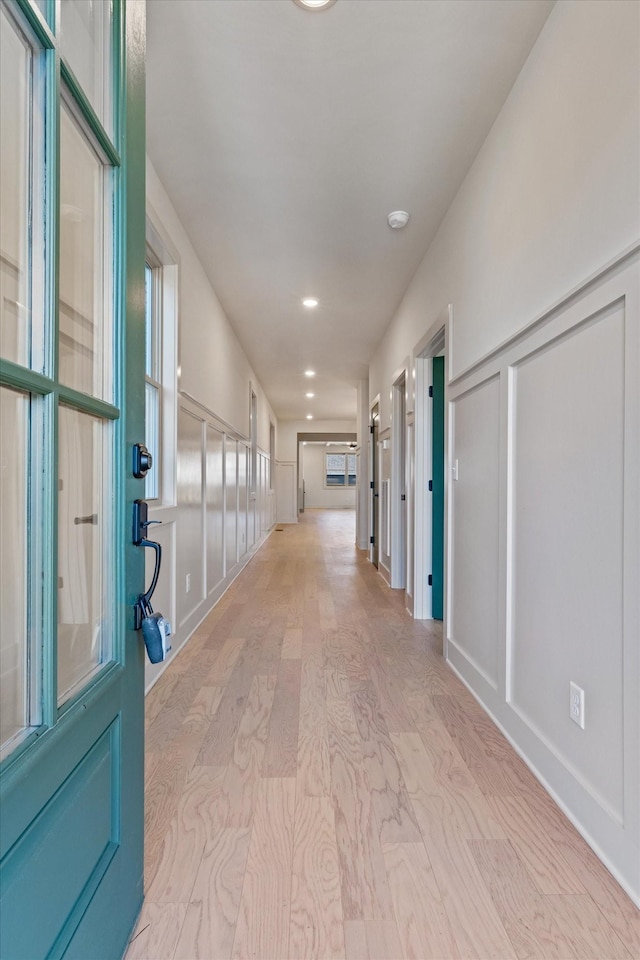 hallway featuring recessed lighting and light wood finished floors