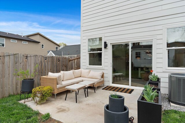 view of patio featuring cooling unit, an outdoor living space, and fence