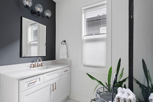 bathroom featuring vanity and baseboards