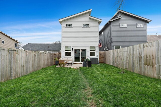 back of house with central AC, a fenced backyard, a lawn, and a patio area