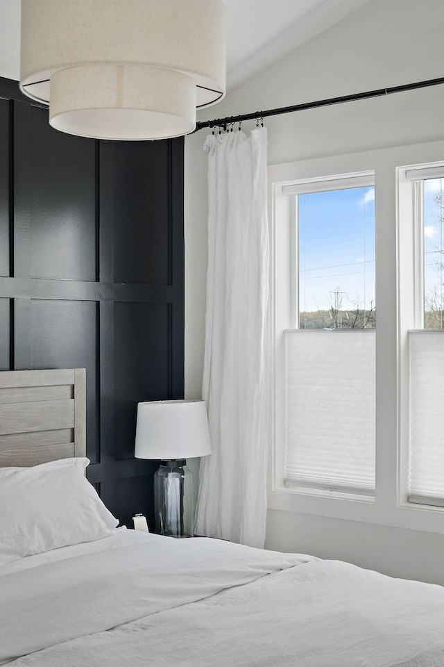 bedroom with lofted ceiling