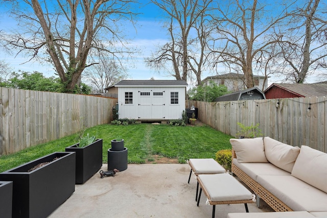 view of patio / terrace featuring a garden, a fenced backyard, an outdoor structure, and an outdoor hangout area