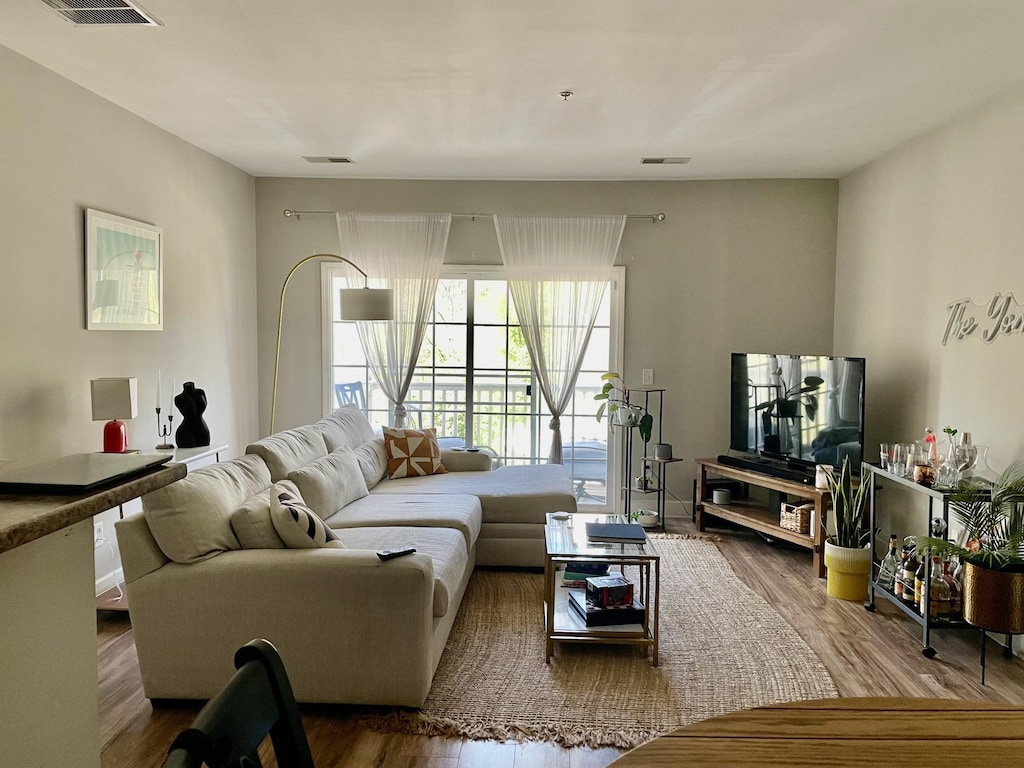 8211 Lenox Creekside Dr Unit 12, Antioch, TN 37013 - living area with wood finished floors and visible vents