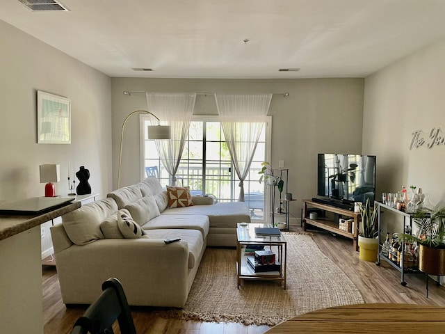 8211 Lenox Creekside Dr Unit 12, Antioch, TN 37013 - living area with wood finished floors and visible vents