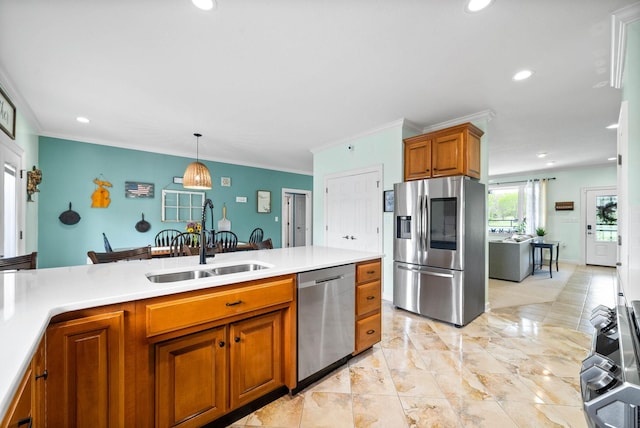 779 Iron Workers Rd W, Clarksville, TN 37043 - kitchen featuring brown cabinets, recessed lighting, light countertops, a sink, and appliances with stainless steel finishes