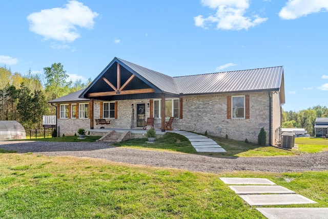 779 Iron Workers Rd W, Clarksville, TN 37043 - ranch-style home featuring a front lawn, a porch, a greenhouse, and metal roof