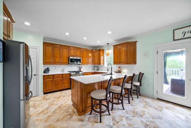 779 Iron Workers Rd W, Clarksville, TN 37043 - kitchen with brown cabinetry, a peninsula, appliances with stainless steel finishes, and a sink
