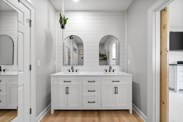 779 Iron Workers Rd W, Clarksville, TN 37043 - full bath featuring wood finished floors, a sink, and double vanity